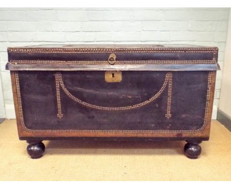 A Regency leather bound camphor wood trunk covered with black studded leather fitted with the original handles      Length - 