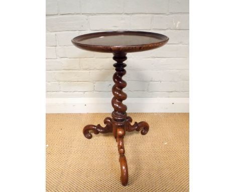 A circular Victorian mahogany wine table on barley twist tripod legs 13" diameter 