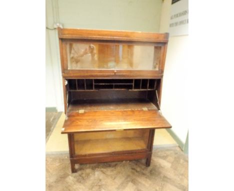 A Globe Wernicke sectional oak bureau bookcase, fitted drawer with glazed upper and lower compartment 34" wide 