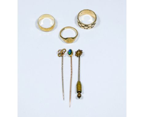 An assortment of jewellery comprising of two 9 carat gold rings weighing approximately 10g, one 18 carat ring weighing approx