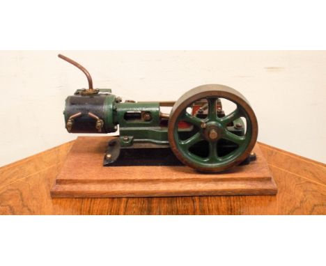 A small live steam stationary engine on wooden base approx 81/2" x 4"