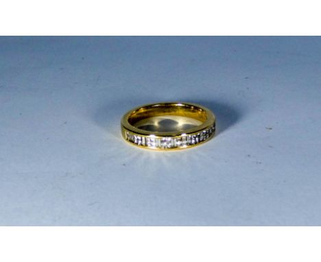 18ct yellow gold half hoop eternity ring channel set with princess cut and baguette cut diamonds, diamond weight 0.5 carats. 