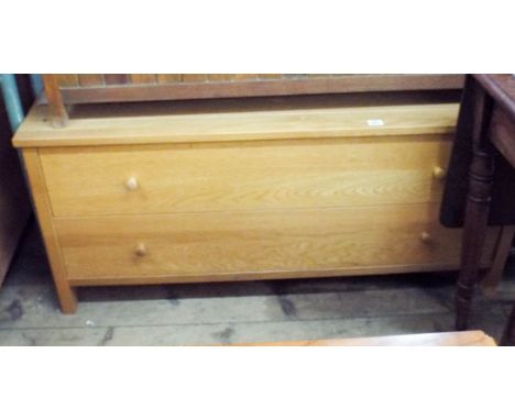 A long low light oak chest of two long drawers 4' wide 