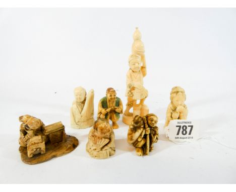 A collection of seven carved Japanese Netsuke and figurines, tallest figurine 12cms 