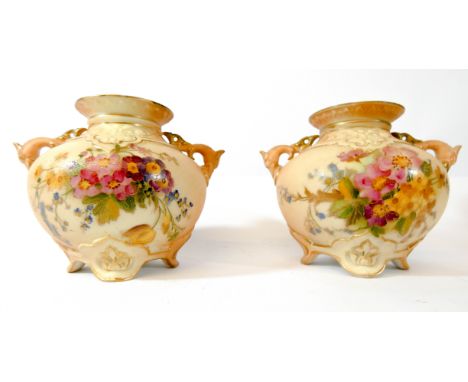 Royal Worcester blush ivory floral decorated pair of twin handled vases number on base 1176, height 9cms   No sign of major d