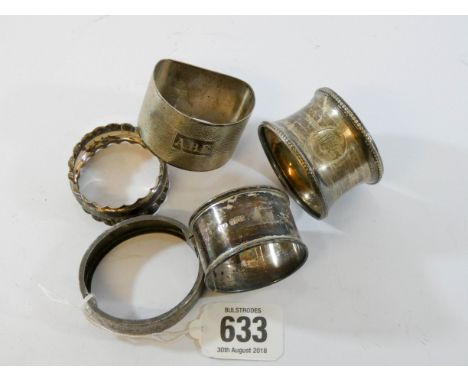 A collection of four silver napkin rings and a child's silver hinged bangle gross weight 2.35 troy ozs 