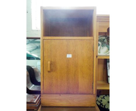 A GPlan light oak chest with four long drawers and formica top, together with two bedside cabinets 