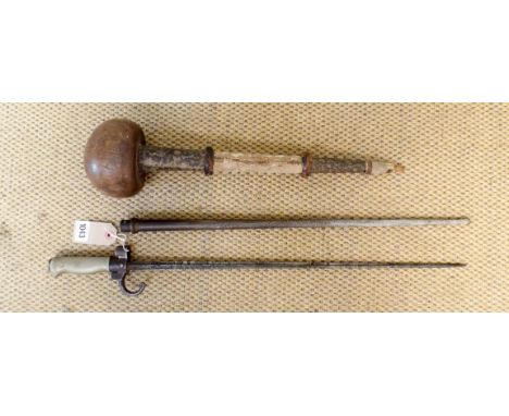 A French World War I bayonet in metal scabbard, straight stiletto type blade approx 201/2" together with a large native club 