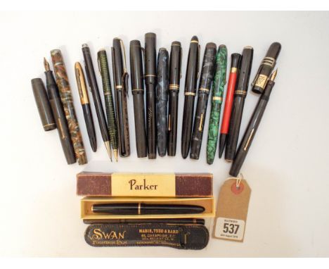 A group of early vintage fountain pens to include: Mabie Todd, Swan and early Swan rubber fountain pen in leather pouch, Conw