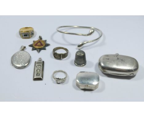 A collection of silver items to include bangle, sovereign case, ingot, medallion and rings etc