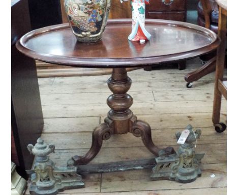 An oval mahogany tray top table on a Victorian walnut pillar and tripod base 