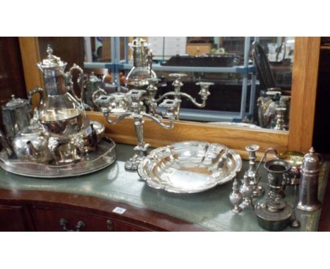 A large quantity of assorted plated items to include teapot, coffee pot, candelabra etc 