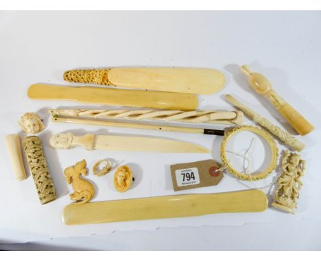 A collection of 19th century carved ivory to include, parasol handle, letter openers, bangle, brooches, cigarette holders etc