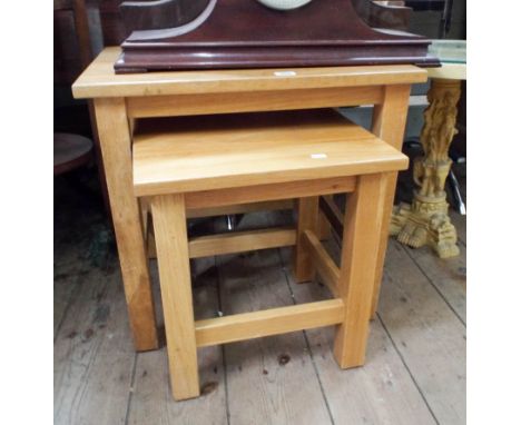 A nest of two heavy, light oak, coffee tables  