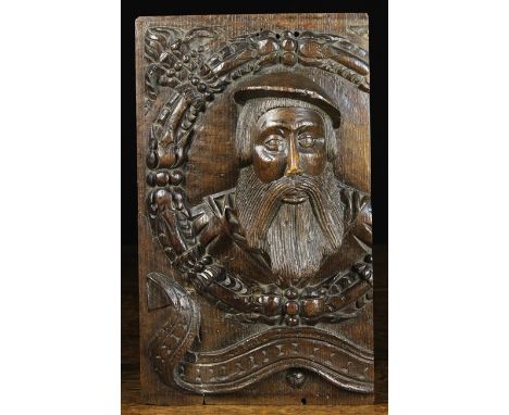 A Fabulous 16th Century Oak Portrait Panel (A/F) carved in high relief with the protuberant head of a fine bearded gentleman 