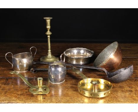 A Collection of Metalware: A late 18th century brass candlestick with petalled base 9½ ins (24 cms) high. Two brass chamber s