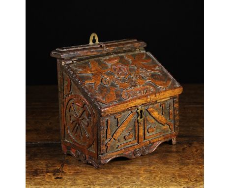 A Delightful 18th Century Treen Carpenter's Candlebox, blind fret carved with the tools of the trade; saws, chisel, set squar