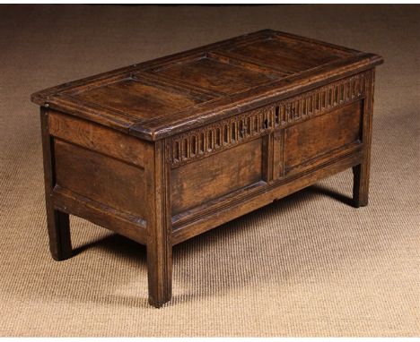 A Sweet 17th Century Joined Oak Coffer of good colour and patination. The triple panel lid in a run-moulded frame on iron loo