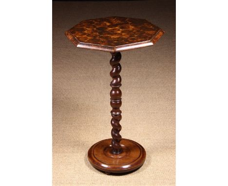 A Fine Laburnum Oyster Veneered Candlestand. The octagonal top clad in honey-comb veneers and raised on a clock-wise and coun