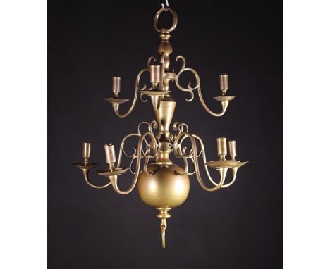 A Small Brass William & Mary Chandelier with later wiring. The knopped stem bearing two tiers of scrolling candle branches; t