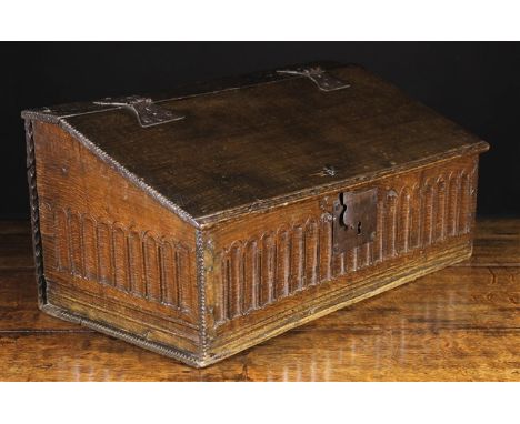 A 17th Century Boarded Oak Desk Box of good rich colour & patination. The sloped lid with chip carved ends and moulded front 