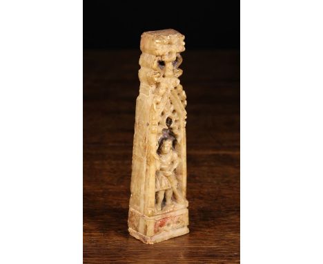 An Early 16th Century Carved Alabaster Finial/Fragment of tapering rectangular column form, carved with a figure stood in an 