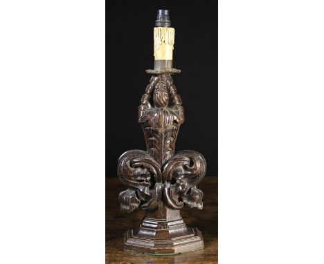 A Carved Oak 'Poppy-head' Pew-end Finial mounted on an octagonal moulded base and converted into a table lamp. The carving 14