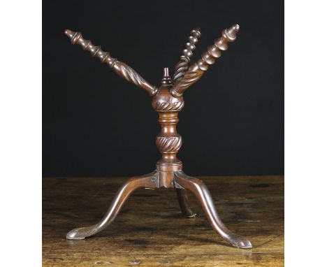 An 18th Century Mahogany 'Cat'. The three splayed screw-in arms ornamented with bobbin turning and wrythen fluting, emanating