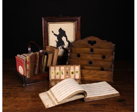 A Collection of Miscellaneous Items: A 19th century framed decoupage silhouette, a boarded oak stationary rack and small 19th