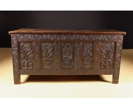 A 17th Century Oak Coffer of Sussex Origin, Circa 1660 with lock and original key. The planked top with incised border lines 