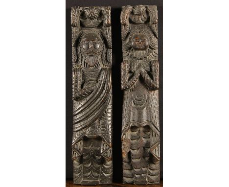 A Pair of Elizabethan Oak Terms depicting an Atlante & Caryatid enriched with chip carving. The bearded male figure with a sa
