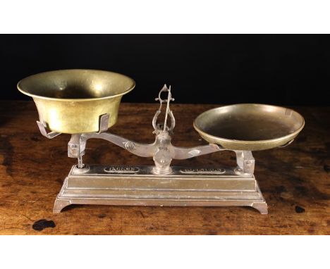 A Pair of 19th Century French Weighing Scales having a brass pan to one side and bowl to the other; both with rolled rims. Th