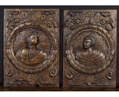 A Pair of 16th Century Romayne Panels carved with portrait busts of man & wife in leafy roundels amidst scroll cartouches ent