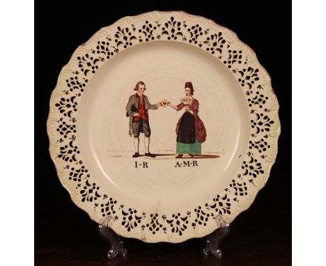 A Charming 18th Century Leeds Pottery Creamware Plate. The centre panel depicting a man & woman holding a heart within a ring