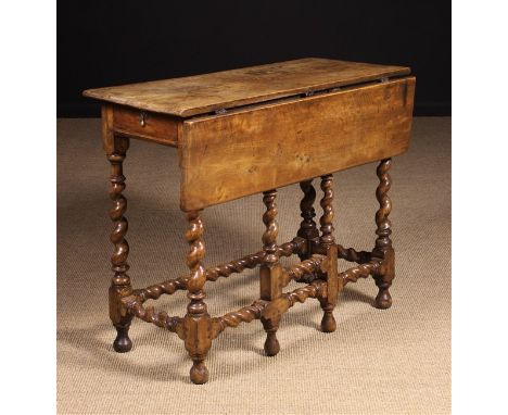 A Late 17th Century Walnut Gateleg Table on turned barley-twist legs united by barley-twist stretchers with a similarly turne