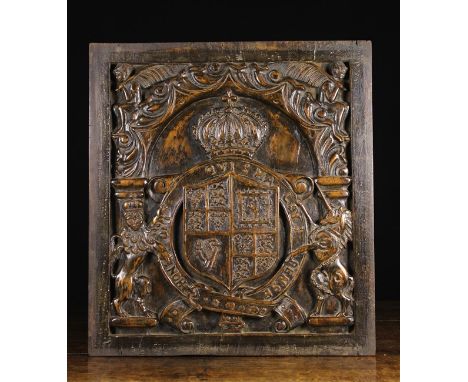 An 18th Century Carved Walnut Armorial Panel carved with crest, 23 ins x 20¾ ins (59 cm x 53 cms).