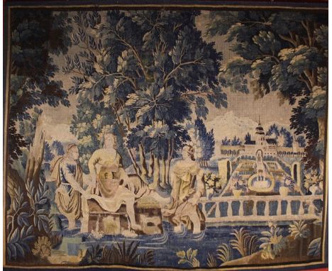 A 17th Century Flemish Verdure Tapestry depicting a lady and two attendants paddling in pool beneath a canopy of trees to the