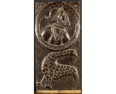 An Unusual 16th Century Romayne Panel carved with a bird beneath the portrait roundel depicting profile bust of a gentleman, 