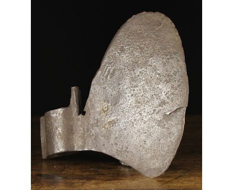 An Iron Axe Head, probably 16th Century, with oval shaft socket, 12½ ins (31.5 cms) wide.