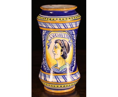 An Italian Maiolica Albarello. The waisted vessel decorated with a portrait medallion to one side below inscribed banner 'LUC