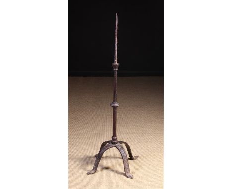 A Good 15th Century Wrought Iron Floor Standing Pricket Stick. The spike on an octagonal knopped stem leading down to a four 