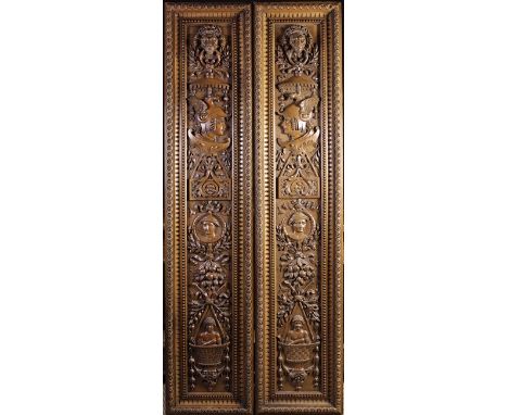 A Pair of Fine Carved Walnut Panels in the Adam Style. The long panels richly carved in relief with lion masks bearing rings 