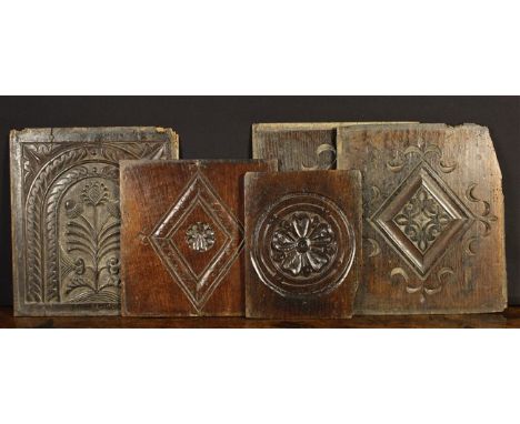 Five 17th Century Oak Panels: A pair with carved lozenge motifs issuing scrolling pennants from the corners (A/F) 13 ins x 11