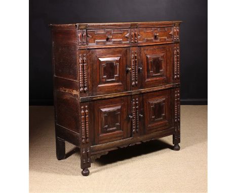 A Late 17th Century Enclosed Food Cupboard decorated with geometric mouldings and split spindle appliqués (A/F).  The top mea