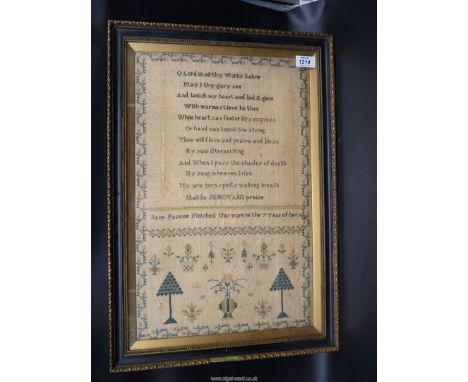 A framed and glazed sampler by Jane Pascoe, aged 7 having a stylised floral border , trees, birds, urns and religious verse '