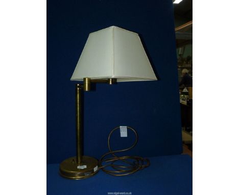 A brass adjustable study lamp with shade, 23'' tall including shade.