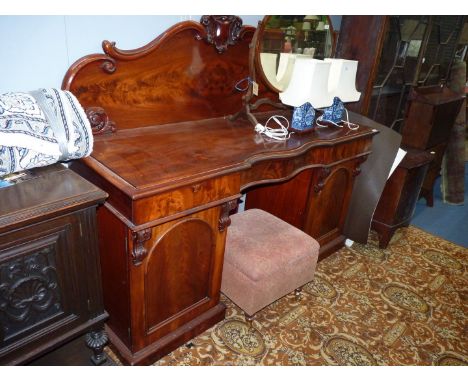 A late 19th c. flame Mahogany double pedestal, dog kennel Sideboard having three frieze drawers, the pedestals with opposing 