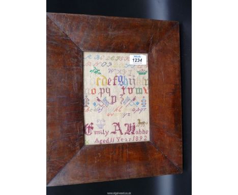 A small, thick dark Maple framed sampler by Emily A. Hobbs, aged 11, 1892, showing the alphabet and flags, 5 1/2'' x 7 1/2''.