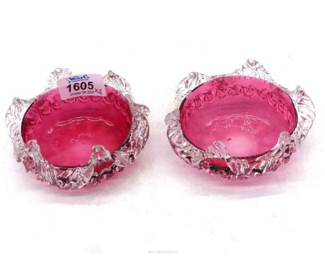 A pair of Vintage cranberry glass bowls each with inner raised spokes, polished round pontils and applied clear crystal decor