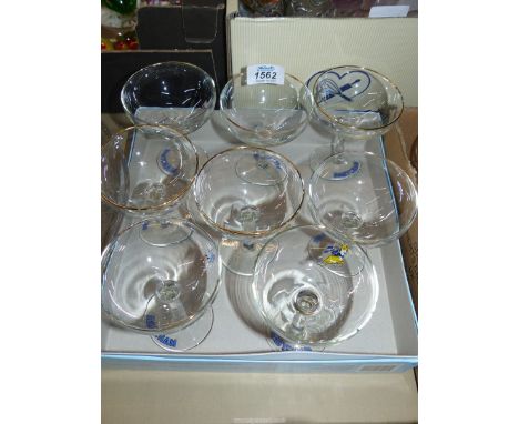 Eight vintage Babycham glasses.